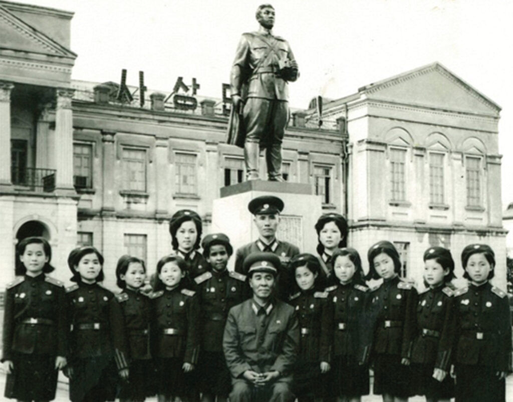 Monica with her ‘platoon’, the platoon leader (behind my right shoulder) and the school director O Chae Won (front centre)