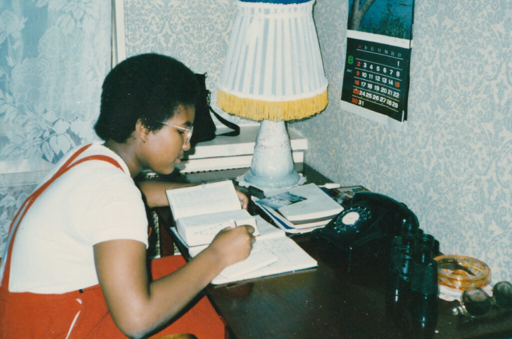 A rare photo of Monica catching up on homework