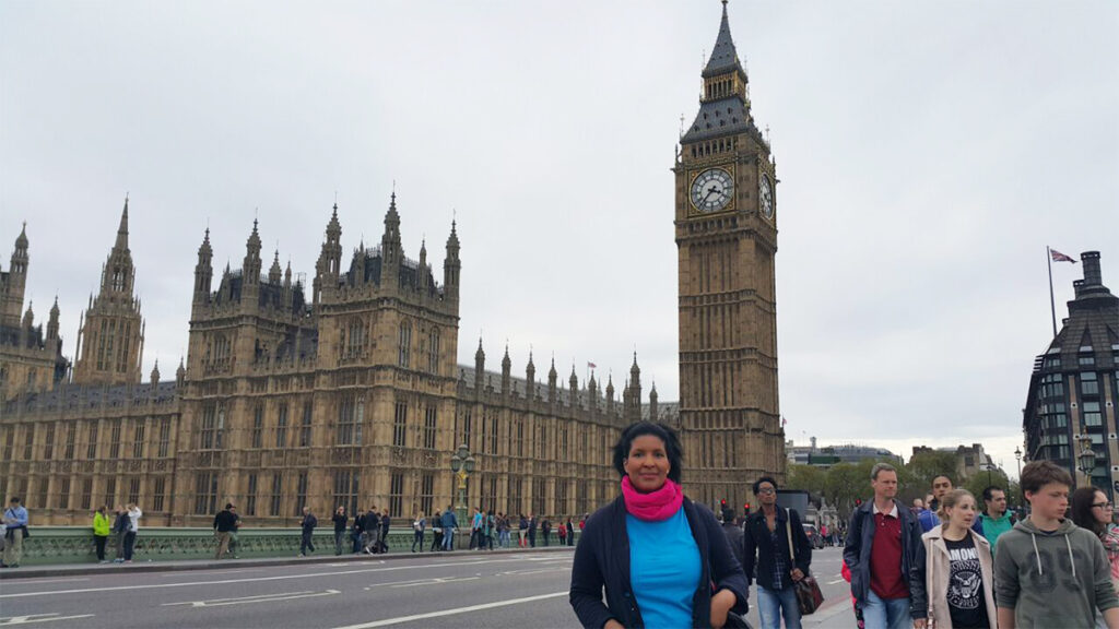 Monica outside the Houses of Parliament, London