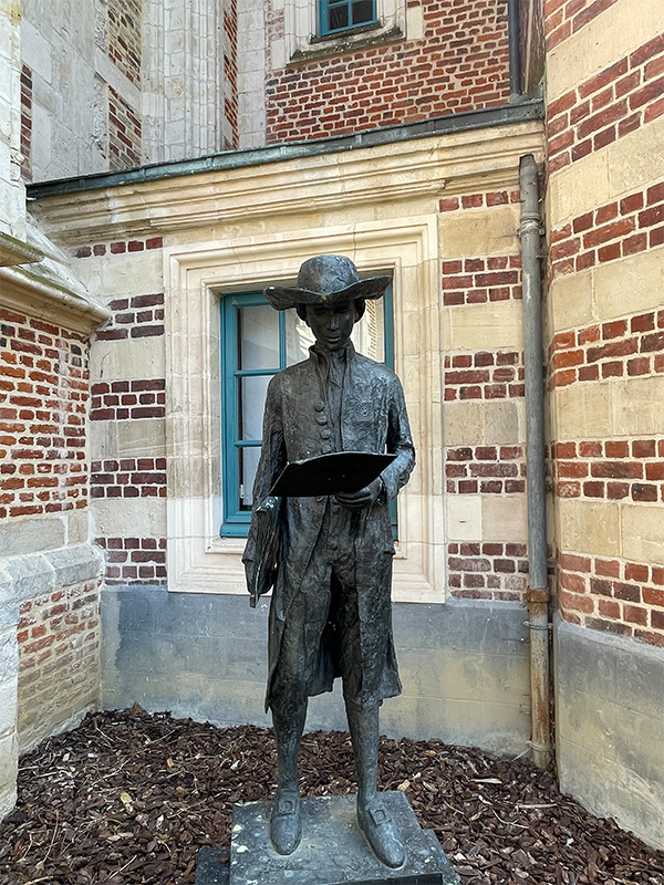 Image of a statue of a Jesuit scholar from St Omers