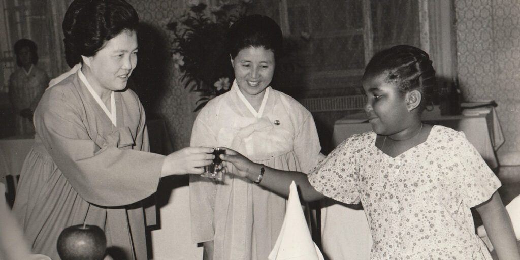 Monica toasting with Kim Song Ae, first lady of North Korea