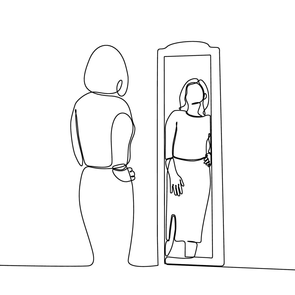 woman looking in mirror