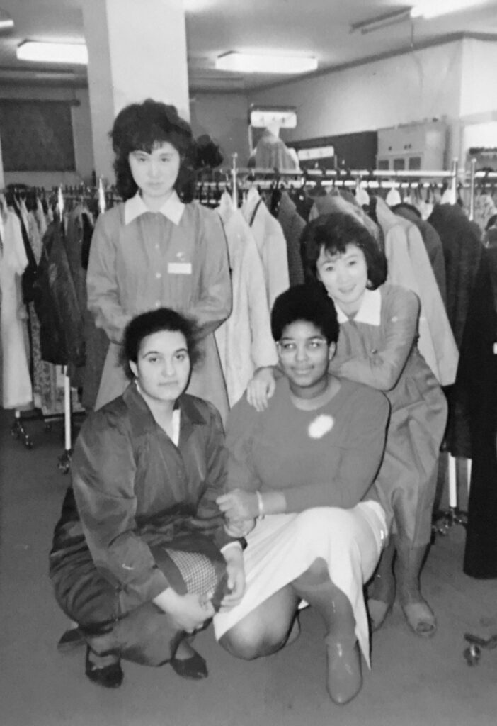 Monica with Maribel and saleswomen at a department store.