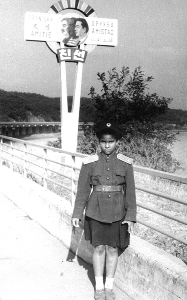 Monica on a highway in uniform.