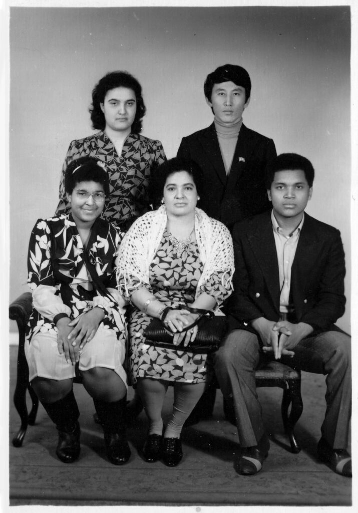 Monica (front, left) with mother (front, centre), Maribel (back, left), Fran (front, right) and his classmate.